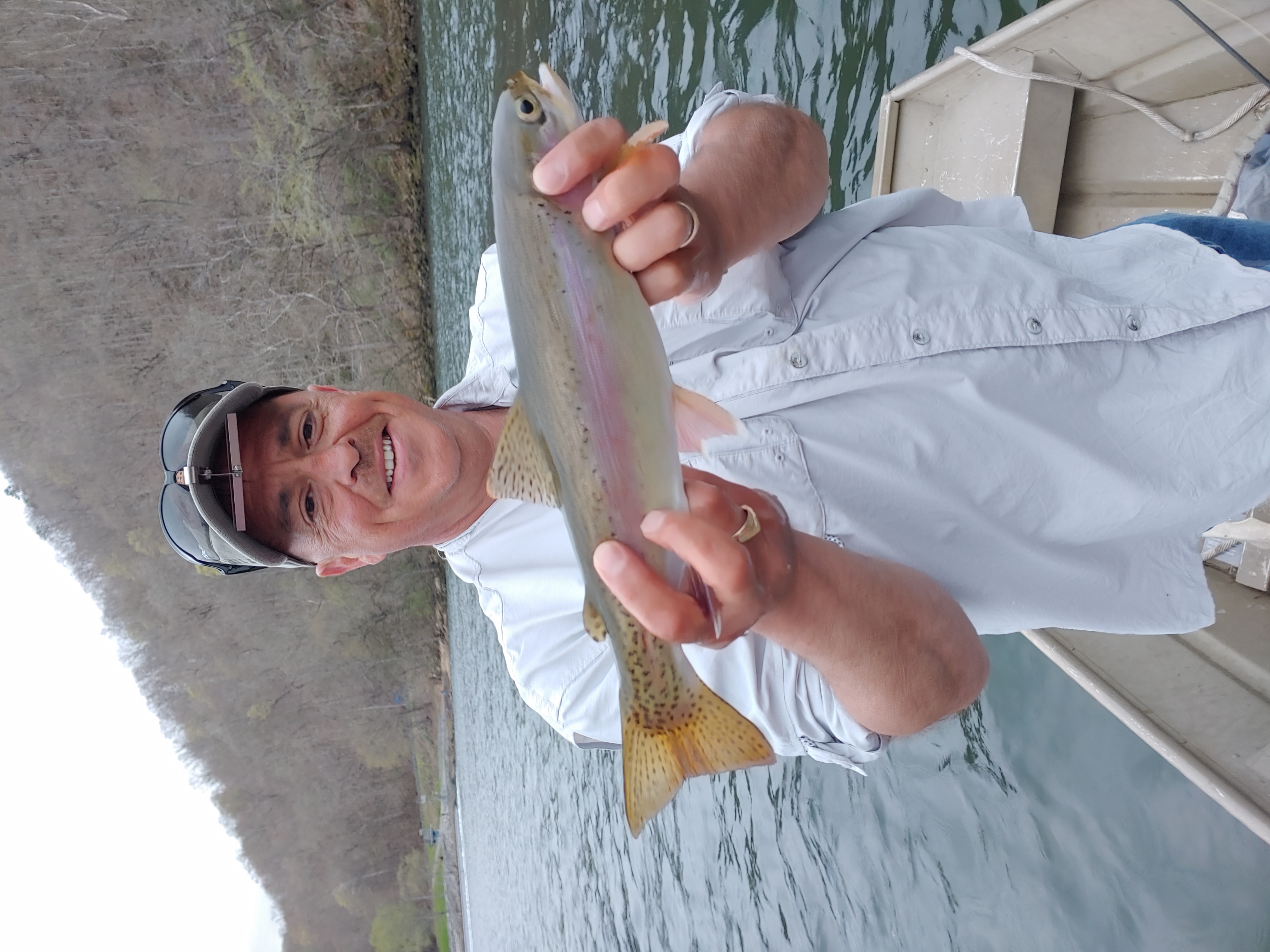 Bobby and Rainbow Trout from the back of the boat