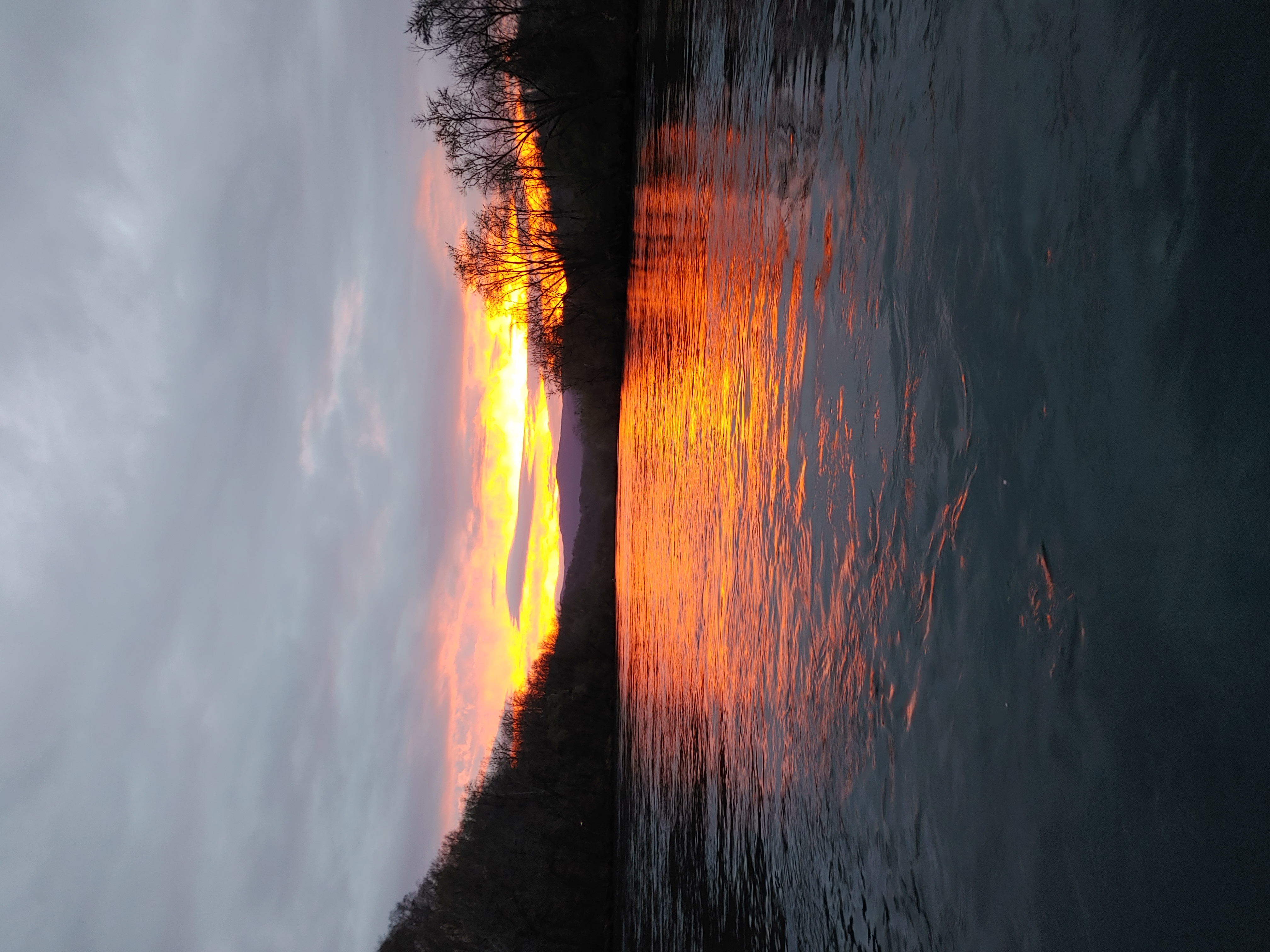 Sunset on the river from the back of a drift boat