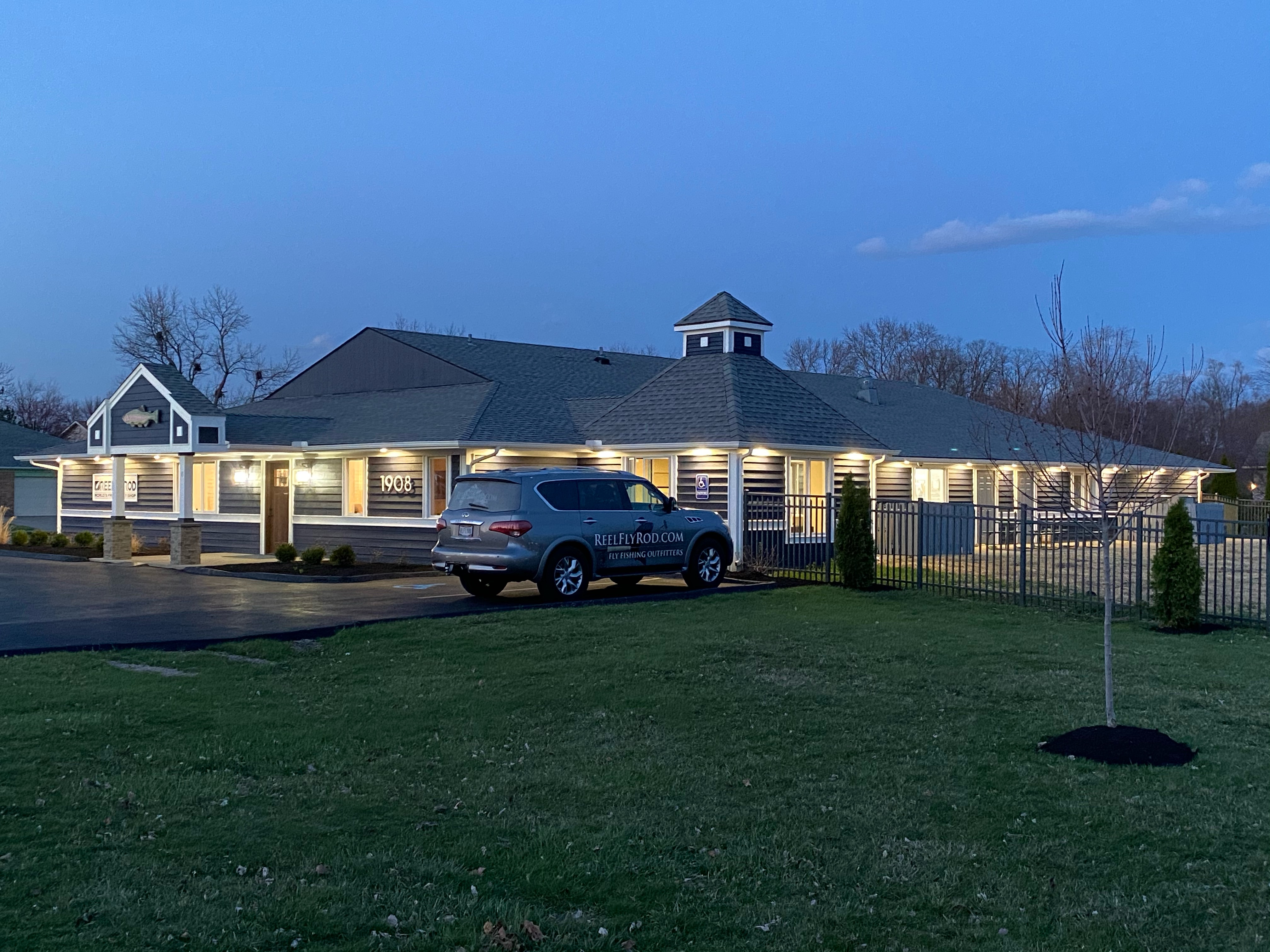 The new shop at dusk with completed exterior and Todd's truck out front
