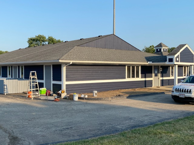 The front of the building and parking lot is starting to come together
