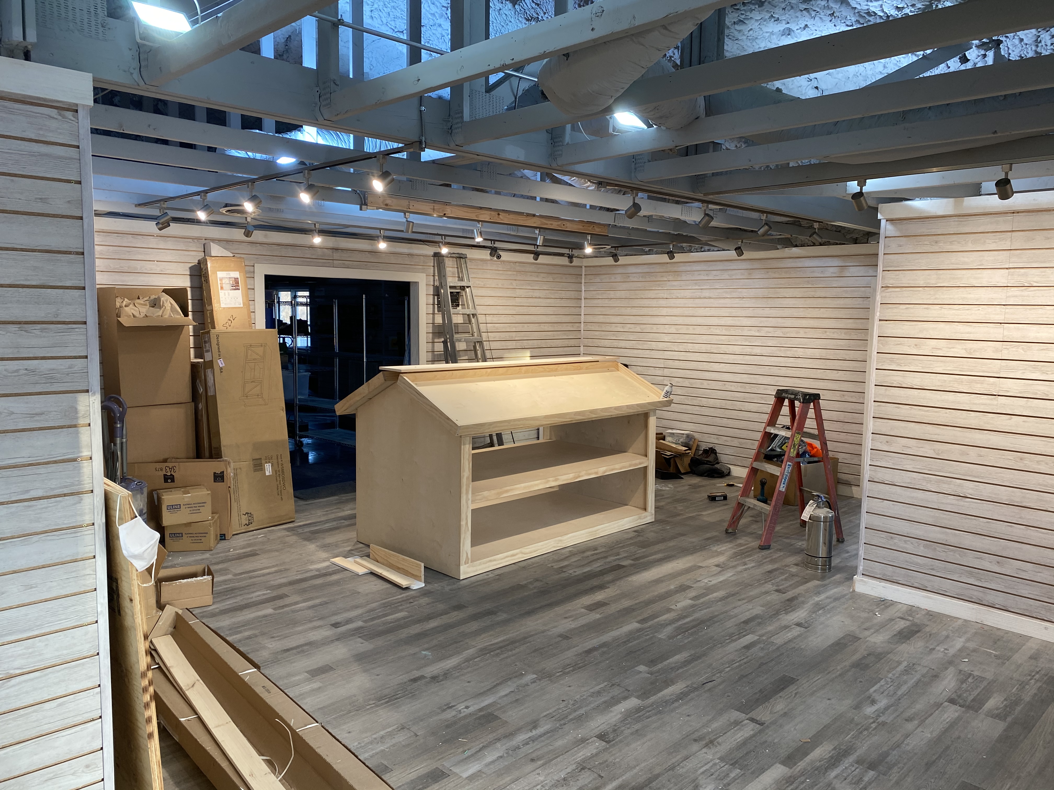 Right side of the under construction storefront and the framed out fly box