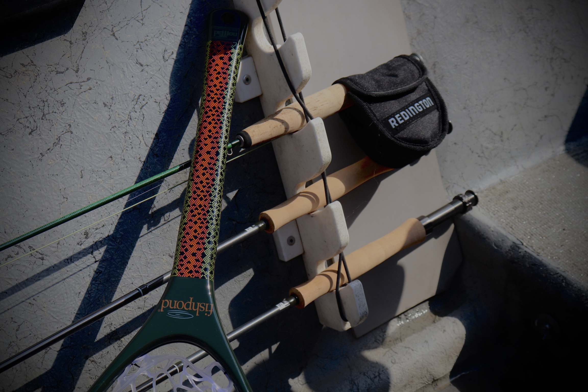 Fishpond Nomad Emerger Redstrip net sitting in the RFR boat next to some of our outfits