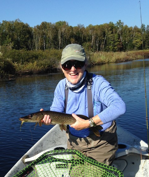Cari pulling a big fish from a big net
